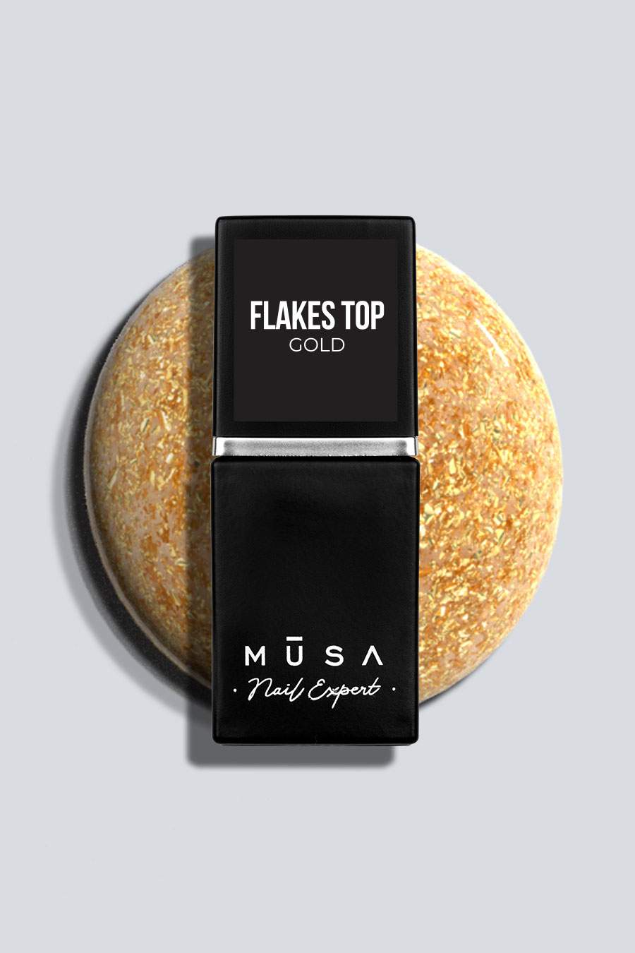 Photo d'un top coat de la marque musa nails appelé Flakes Top gold. contient des paillettes dorées qui le rend unique et original.