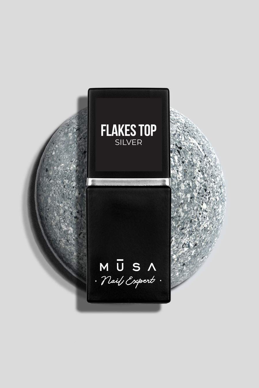 Photo d'un top coat de la marque musa nails appelé Flakes Top Silver. contient des paillettes argentées qui le rend unique et original.